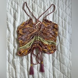 Like new Free People ruched tank top with tassels.